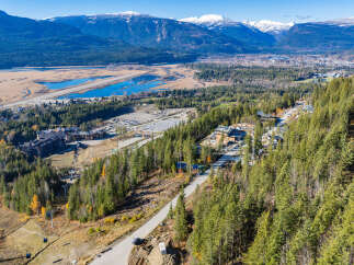 This stunning property offers breathtaking views of the surrounding mountains and valleys.