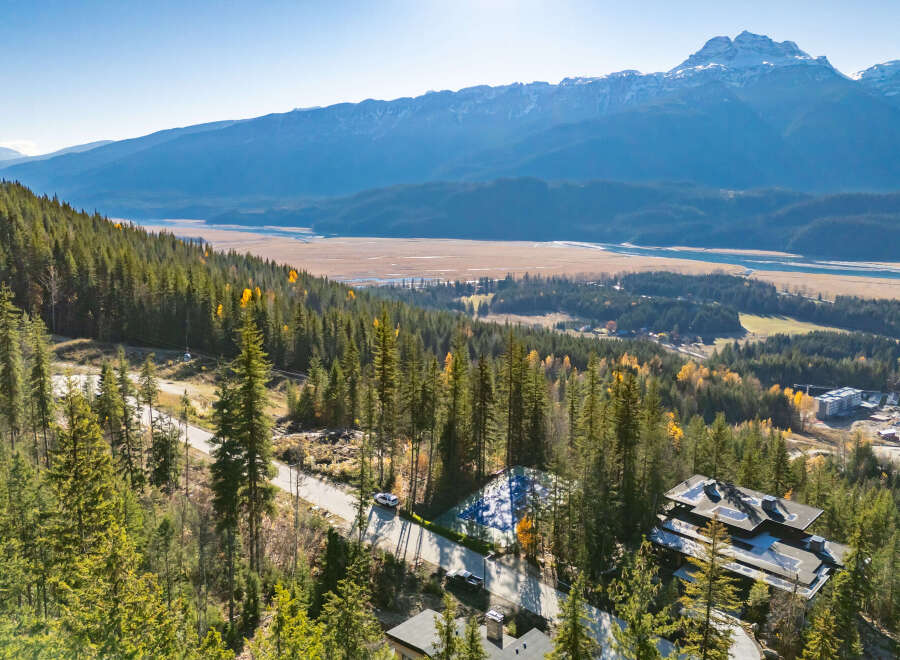 Nestled in a serene mountain landscape, this property offers unparalleled views and a tranquil living experience.