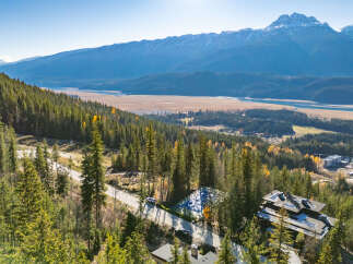 Nestled in a serene mountain landscape, this property offers unparalleled views and a tranquil living experience.