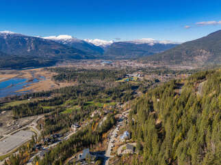Discover breathtaking mountain views and lush greenery in this stunning aerial shot.