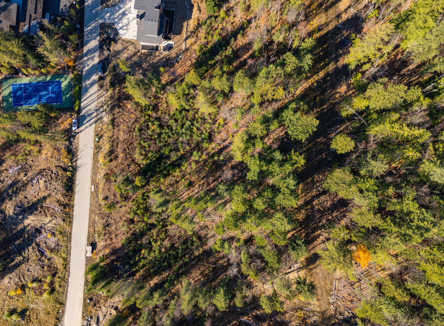 Discover a stunning property nestled in a serene, wooded area, offering unparalleled privacy and natural beauty.