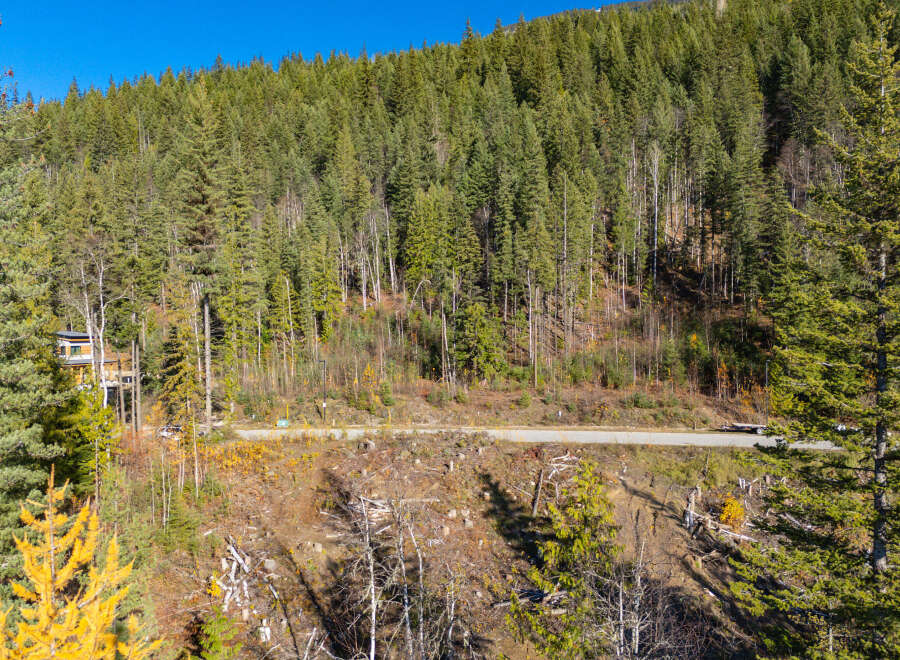 Nestled in a serene mountain landscape, this property offers a unique blend of natural beauty and modern living.