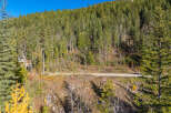 Nestled in a serene mountain landscape, this property offers a unique blend of natural beauty and modern living.