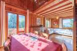 This charming wooden cabin offers a warm and inviting atmosphere, perfect for a relaxing getaway.