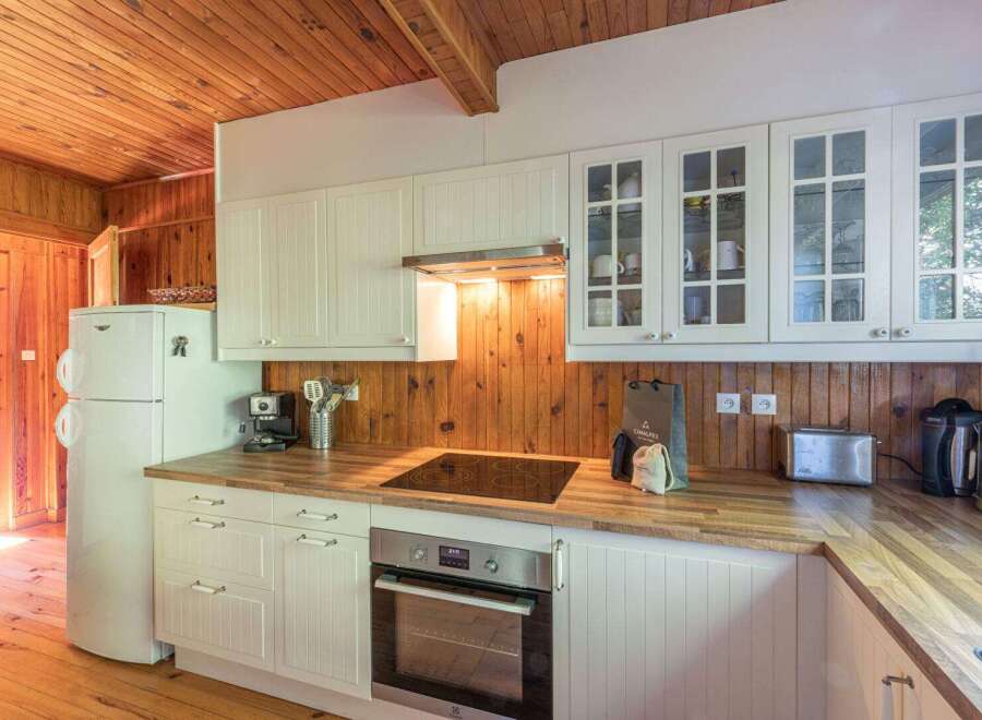 This charming kitchen boasts a warm and inviting atmosphere, perfect for culinary adventures.