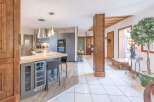 This stunning property boasts a beautifully designed kitchen with modern appliances and a stylish breakfast bar, perfect for entertaining.