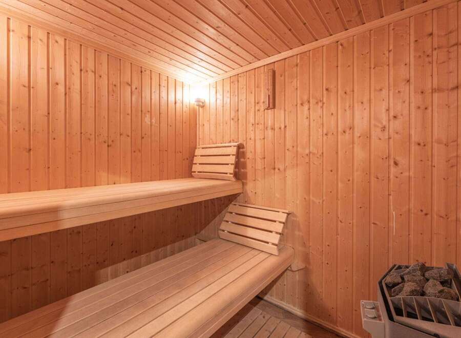 Step into relaxation with this inviting sauna.