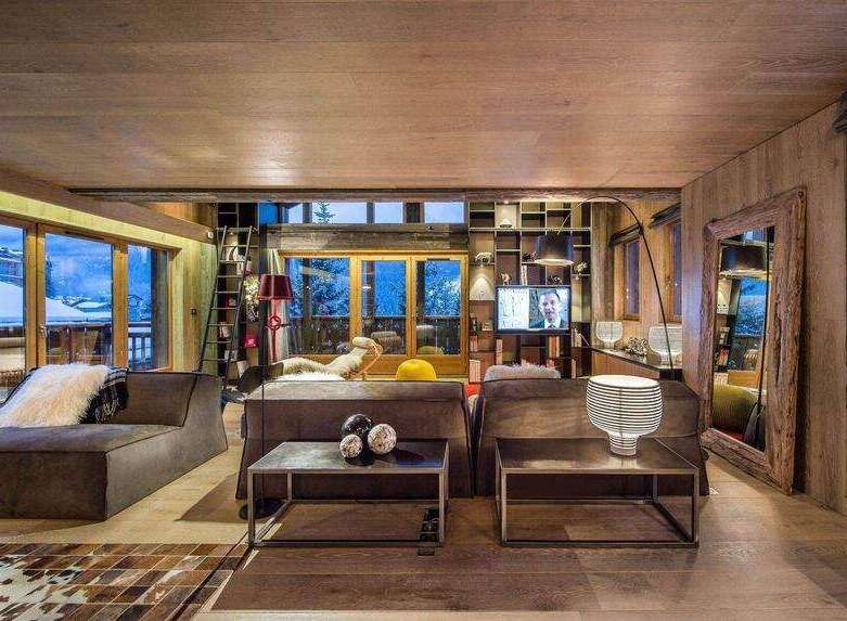 Experience the epitome of luxury living in this stunning chalet, boasting a warm and inviting ambiance.