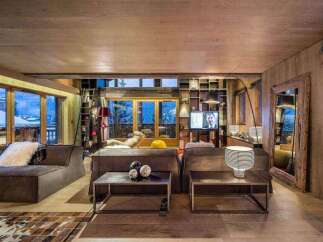 Experience the epitome of luxury living in this stunning chalet, boasting a warm and inviting ambiance.