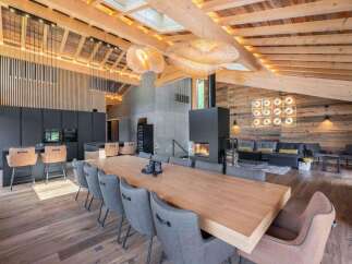 This stunning property boasts a modern, open-concept design with a focus on natural materials.