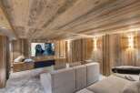 Experience luxury in this stunning home theater, featuring exquisite wood paneling and a cozy, inviting atmosphere.