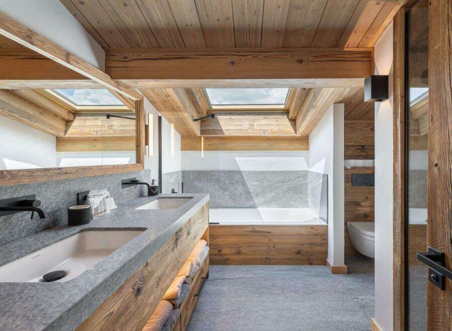 Experience luxury in this stunning bathroom featuring a rustic wooden design.