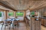 Experience rustic elegance in this stunning property, featuring a beautifully designed dining area and a stylish kitchen.