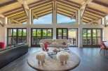 Experience luxury living in this stunning property, featuring a spacious living room with breathtaking views.