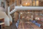 This stunning property boasts a rustic charm with its wooden walls and ceiling, creating a warm and inviting atmosphere.