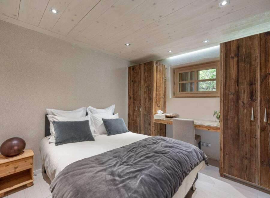 Discover the charm of this cozy bedroom, featuring a comfortable bed and stylish decor.