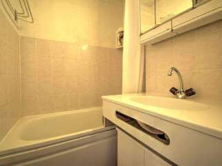 This bathroom features a clean and functional design, perfect for a comfortable living experience.