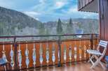 Enjoy breathtaking mountain views from this charming balcony.
