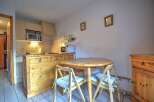 This charming kitchen features a cozy dining area, perfect for enjoying meals.