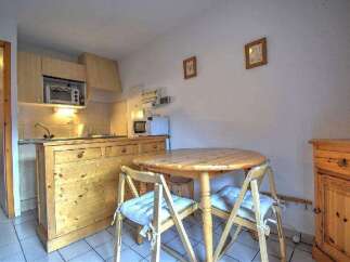This charming kitchen features a cozy dining area, perfect for enjoying meals.