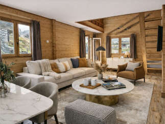 This stunning property boasts a warm and inviting living space, perfect for relaxation and entertaining.