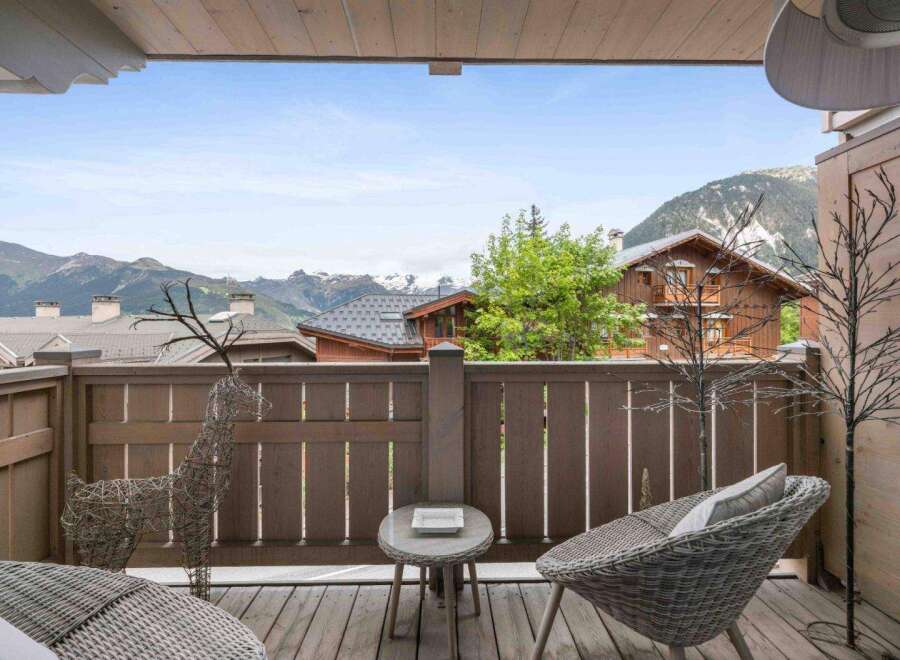 Enjoy breathtaking mountain views from this charming balcony.