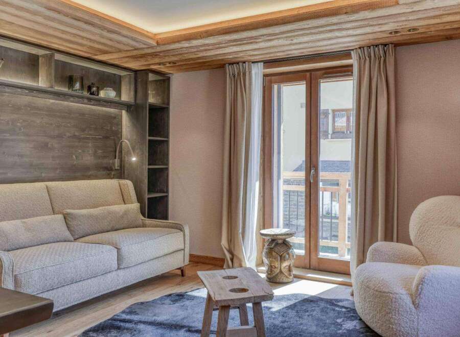 Step into luxury with this stunning property featuring a cozy living room.