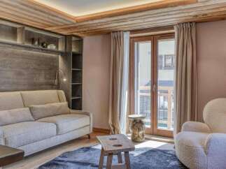 Step into luxury with this stunning property featuring a cozy living room.
