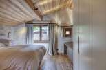 Experience rustic elegance in this stunning bedroom.