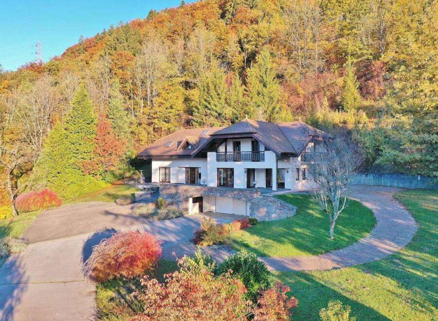 Nestled amidst a vibrant autumnal landscape, this stunning property offers a serene retreat.