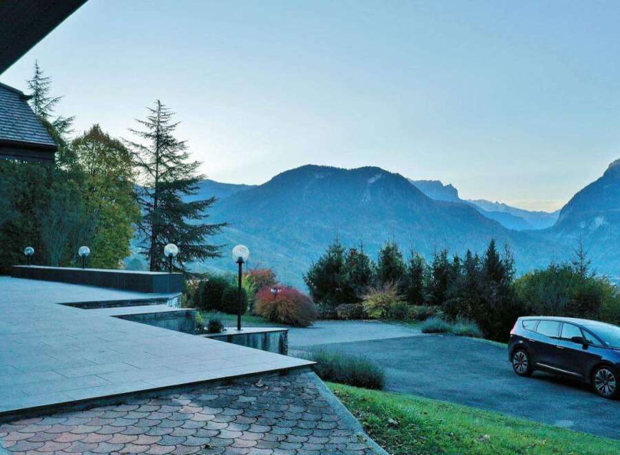 Experience the tranquility of this stunning property nestled amidst breathtaking mountain views.