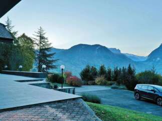 Experience the tranquility of this stunning property nestled amidst breathtaking mountain views.
