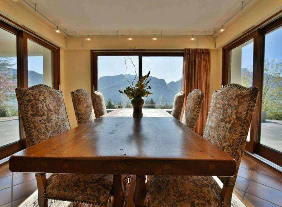 Enjoy breathtaking mountain views from this elegant dining room.