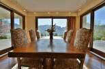 Enjoy breathtaking mountain views from this elegant dining room.