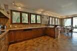 This stunning kitchen boasts a warm and inviting atmosphere, perfect for culinary enthusiasts.