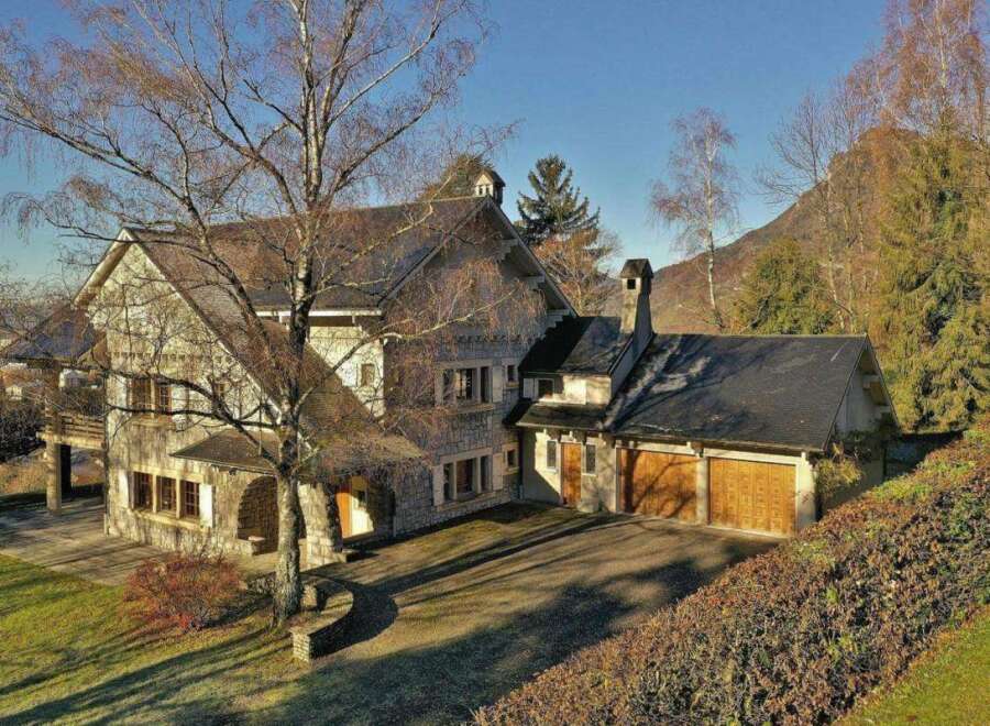 This stunning property boasts a beautiful stone facade and a charming architectural design.