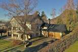 This stunning property boasts a beautiful stone facade and a charming architectural design.