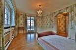 Step into a world of timeless elegance with this stunning bedroom.