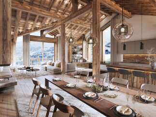 Experience luxury living in this stunning chalet, boasting a warm and inviting interior with exposed wooden beams and a cozy fireplace.