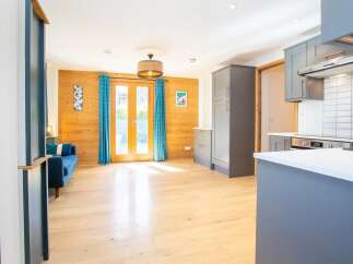 This stunning property boasts a bright and airy open-plan living space, perfect for modern living.