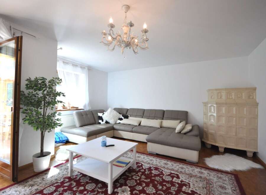 Step into luxury with this stunning living space! Featuring a modern sectional sofa, elegant chandelier, and a cozy fireplace, this home offers both style and comfort.