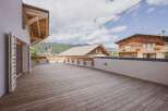 Enjoy breathtaking mountain views from this stunning property! This home features a spacious wooden deck, perfect for outdoor entertaining and relaxation.