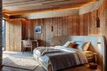 Experience rustic luxury in this stunning bedroom.