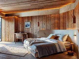 Experience rustic luxury in this stunning bedroom.