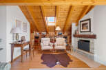 This stunning property boasts a warm and inviting interior with a focus on natural materials.