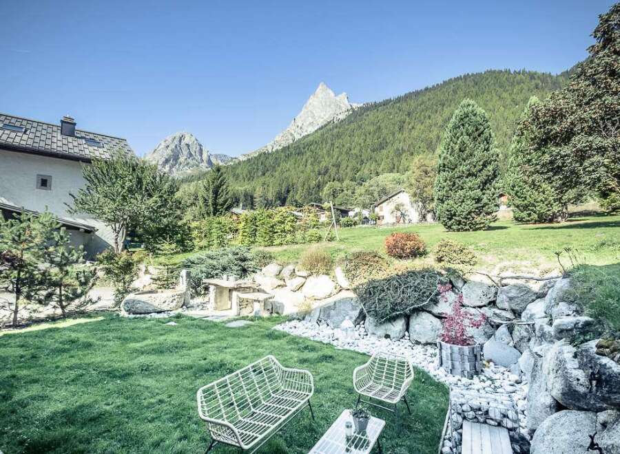 Experience the tranquility of this stunning property, boasting a beautifully landscaped garden with breathtaking mountain views.