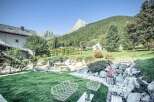 Experience the tranquility of this stunning property, boasting a beautifully landscaped garden with breathtaking mountain views.