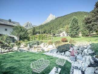 Experience the tranquility of this stunning property, boasting a beautifully landscaped garden with breathtaking mountain views.