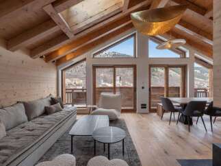 Experience luxury living in this stunning chalet, boasting a spacious open-plan design and breathtaking mountain views.