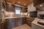 This stunning kitchen boasts a modern design with high-end appliances and ample counter space.